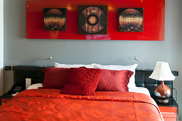 Image showing Red luxurious bed in a hotel