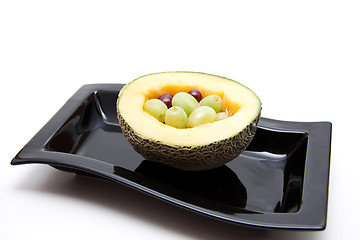 Image showing Melon with grapes