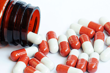 Image showing Red-and-white capsules