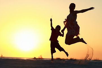 Image showing Family jumping