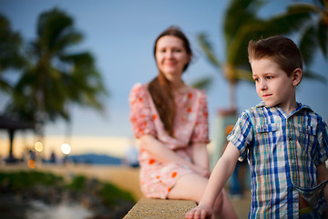 Image showing Mother and son enjoying sunset