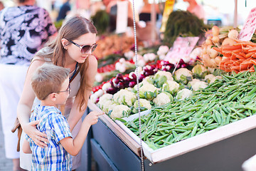 Image showing Mother and son at market