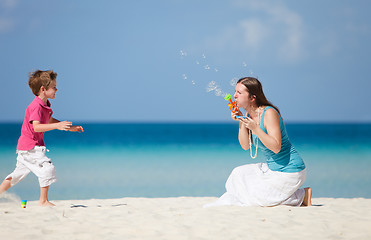 Image showing Mother and son making soap bubbles