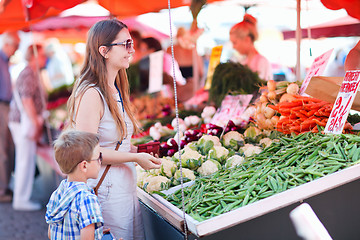 Image showing Mother and son at market