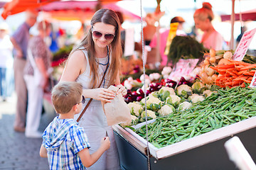 Image showing Mother and son at market