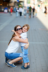 Image showing Mother and son hugging