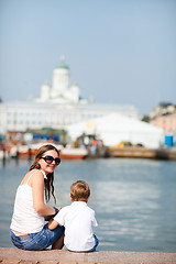 Image showing Vertical photo of mother and son in city center Helsinki Finland