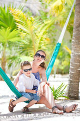 Image showing Mother and son relaxing in hammock