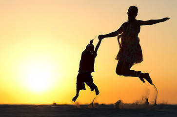 Image showing Family jumping