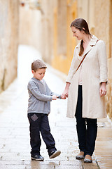 Image showing Mother and son outdoors in city