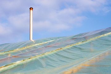 Image showing Film greenhouses with the chimney