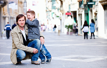 Image showing Father and son in city