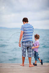 Image showing Father and son fishing together