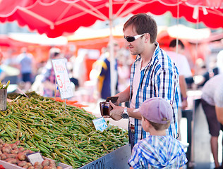 Image showing Father and son at market