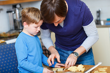 Image showing Father and son baking together