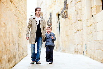 Image showing Father and son in city