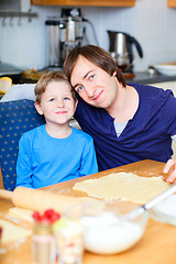 Image showing Father and son baking