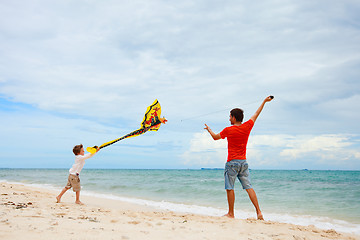 Image showing Father and son flying kite