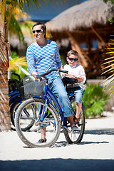 Image showing Father and son on bike