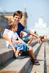 Image showing Father and son enjoying day out in city center