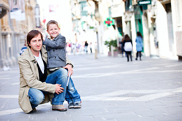 Image showing Father and son outdoors in city