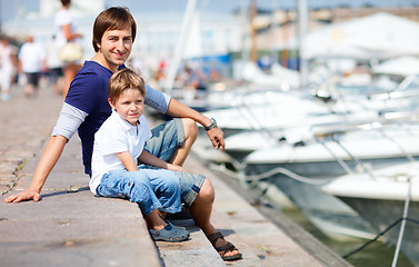 Image showing Father and son at marina in city center