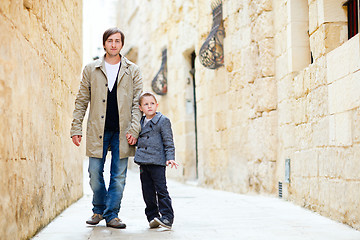 Image showing Father and son outdoors in city