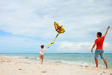 Image showing Father and son flying kite