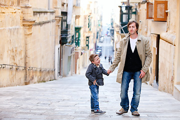 Image showing Father and son in city