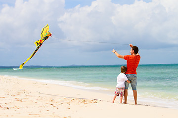 Image showing Father and son flying kite