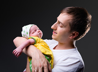 Image showing Happy young father and newborn girl