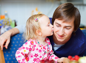 Image showing Adorable little girl kissing her father