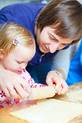 Image showing Father baking together with his daughter