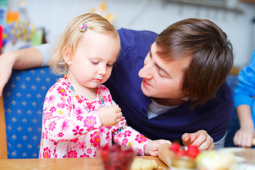 Image showing Father and daughter baking