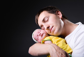 Image showing Happy young father and newborn girl