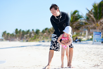 Image showing Father and daughter at beach