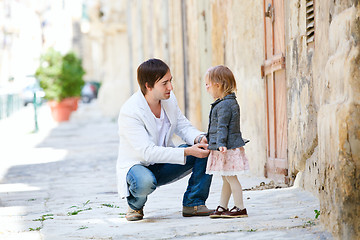 Image showing Father and daughter outdoors in city