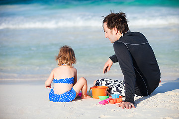 Image showing Father and daughter at beach