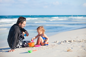 Image showing Father and daughter at beach