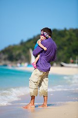 Image showing Father and his daughter standing near oceanfront