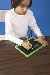 Image showing little girl writing on board