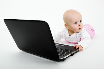 Image showing Baby girl with a laptop