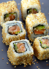 Image showing sushi with salmon and cucumber with sesame seeds