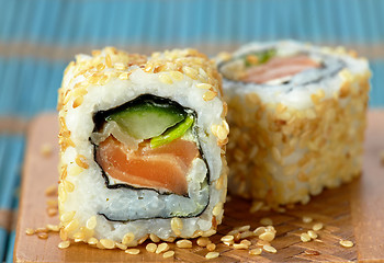 Image showing sushi with salmon and cucumber with sesame seeds