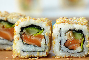 Image showing sushi with salmon and cucumber with sesame seeds