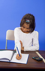 Image showing little girl writting