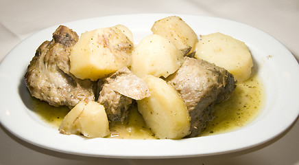 Image showing Greek food lamb lemon sauce with potatoes