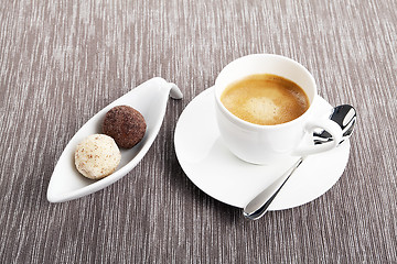 Image showing cup of coffee with mixed pralines 