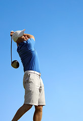 Image showing 	golfer shooting a golf ball