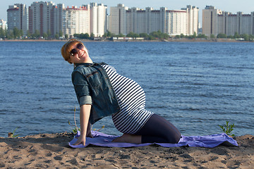 Image showing Pregnant woman doing gymnastic exercises